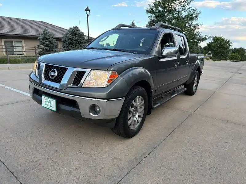2009 Nissan Frontier 4.0 LE Crew Cab 4X4 AT LWB's photo