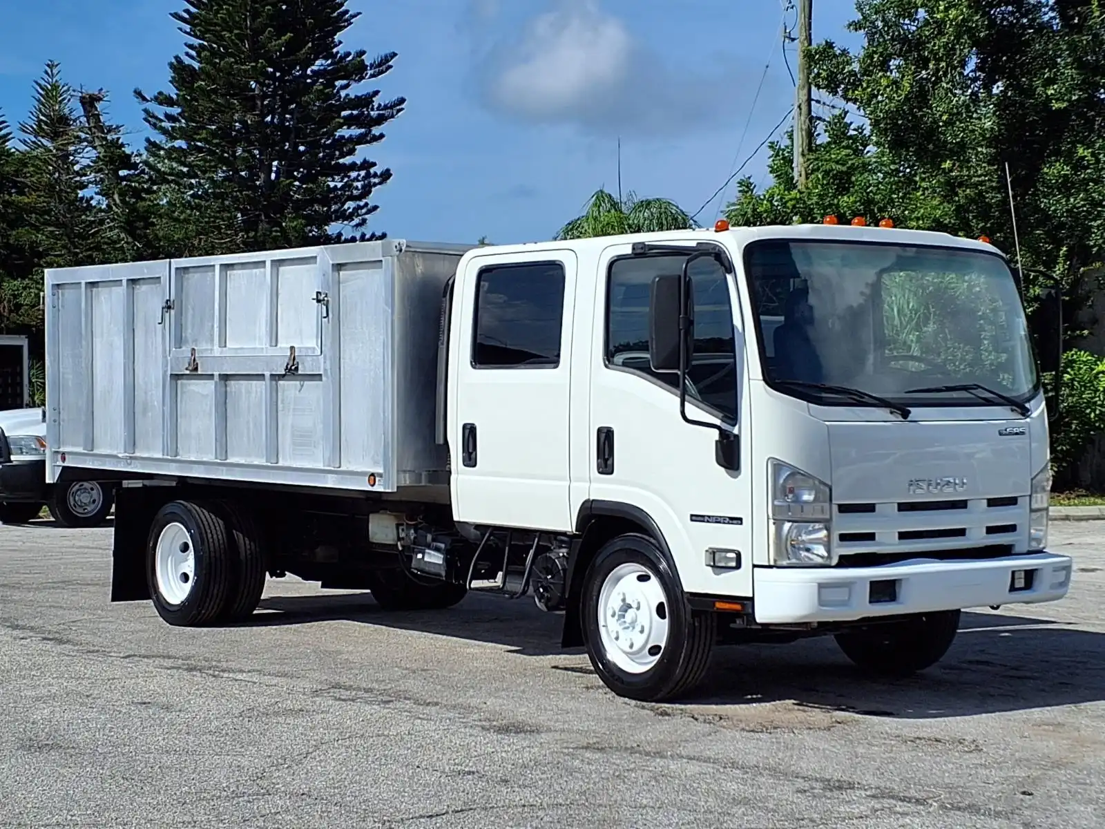 2015 Isuzu NPR-HD Crew Cab 14 Landscape Dump Truck's photo